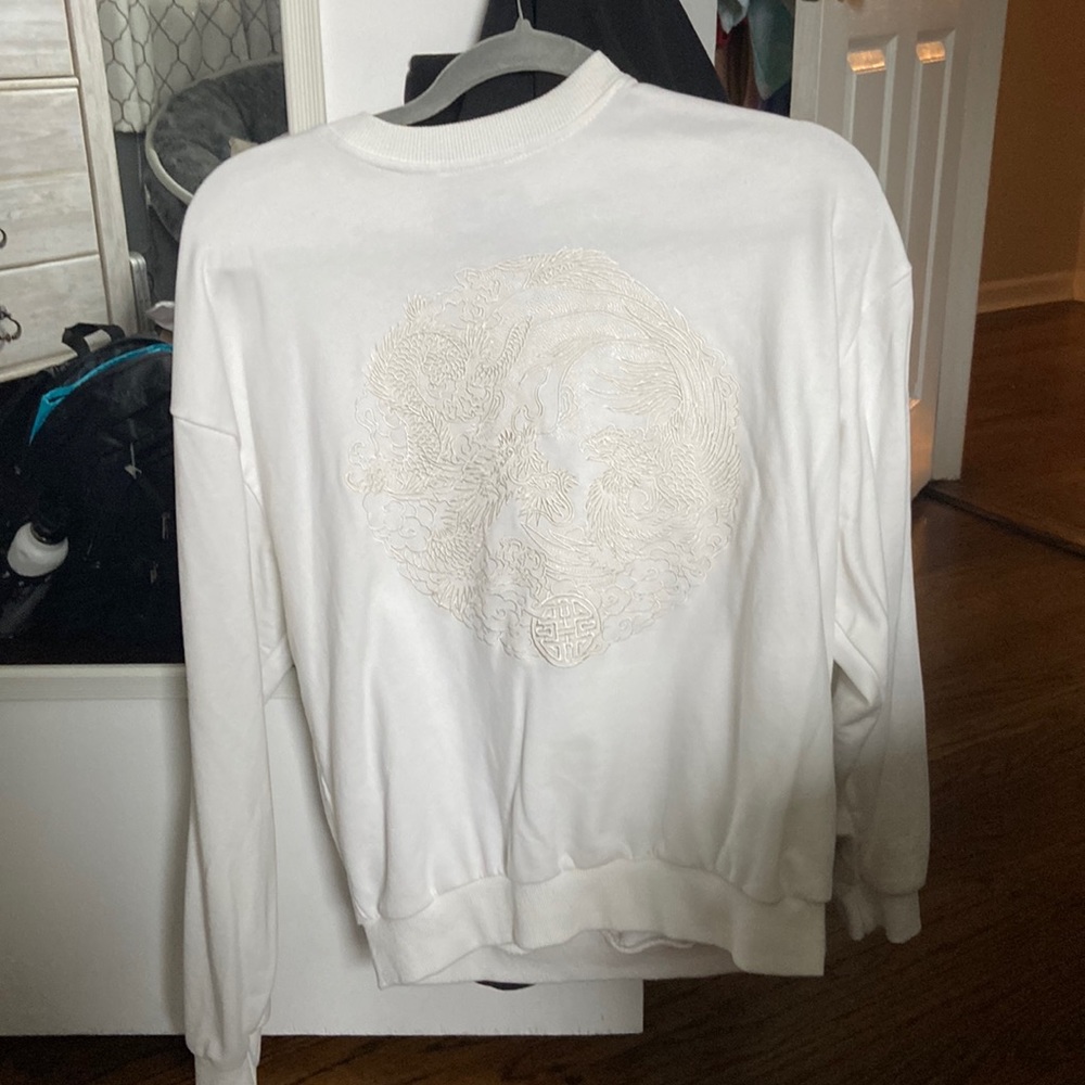 white crewneck with embroidery
